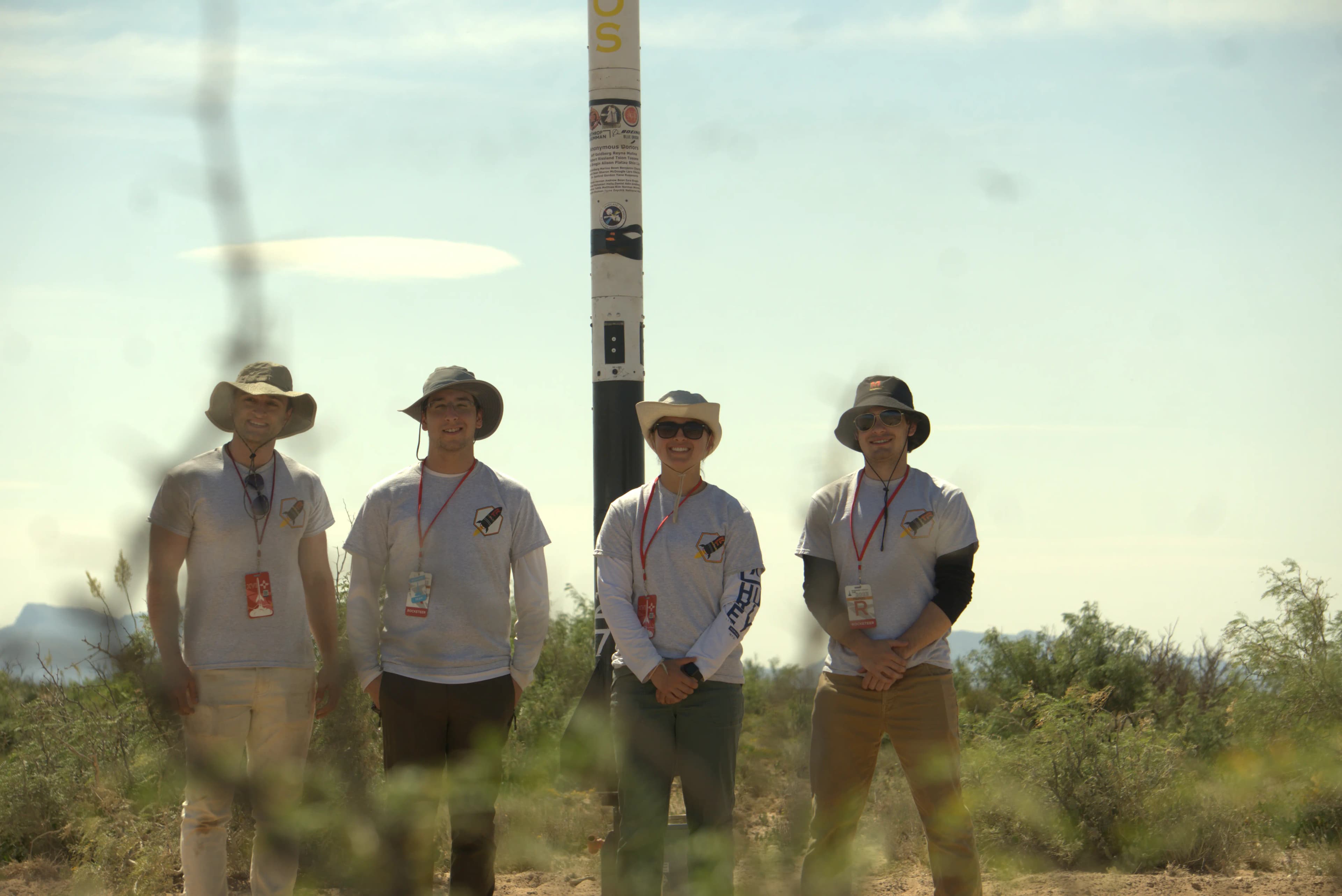 Group photo with the complete rocket erected vertical