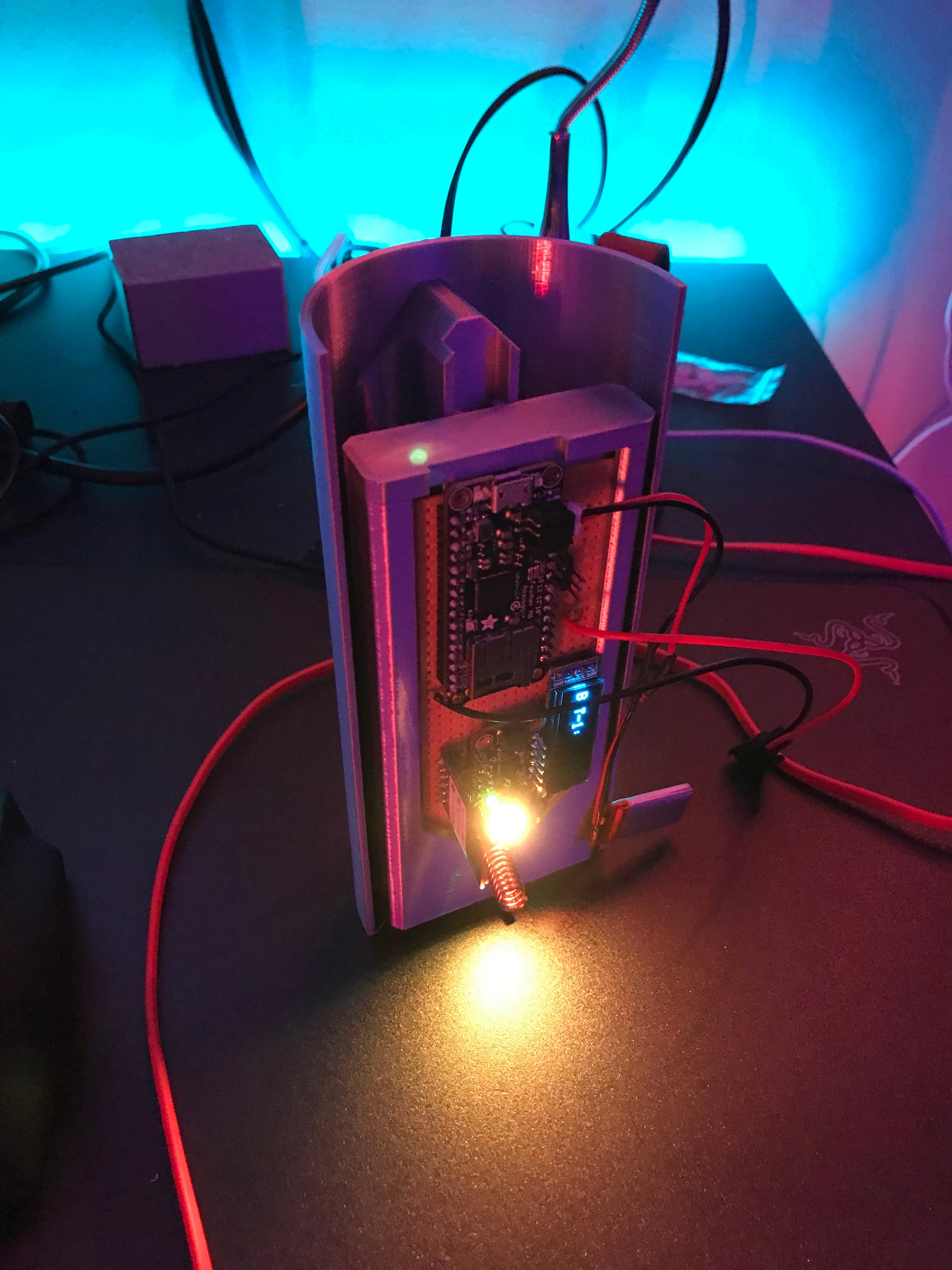 Close-up photo of electronics assembly bay showing flight computer, battery compartment, servo controllers, and internal cable routing